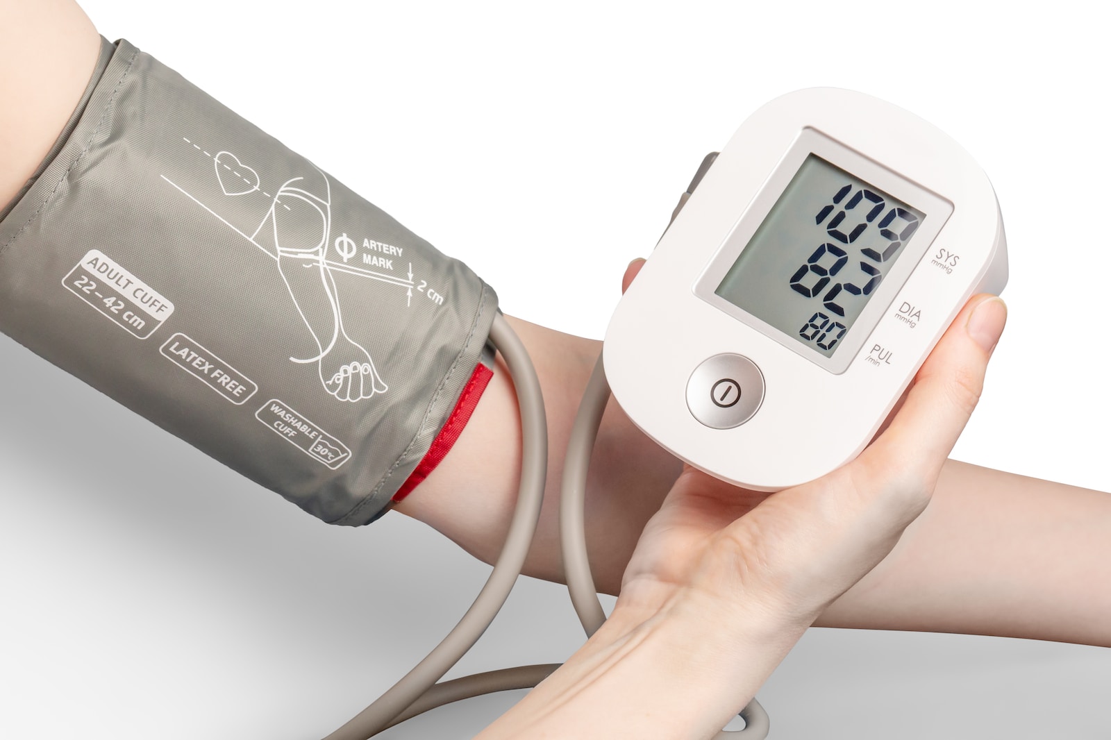 white and black digital device measuring blood pressure